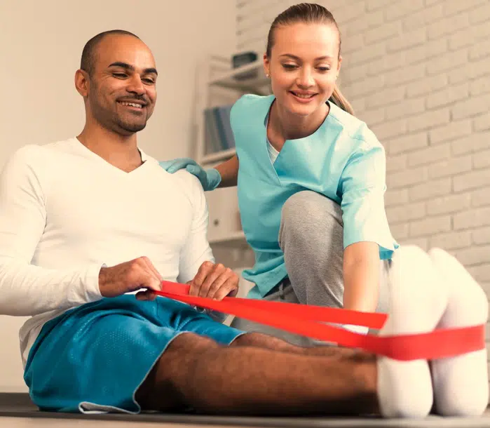 physical therapist doing Physical Therapy with a patient