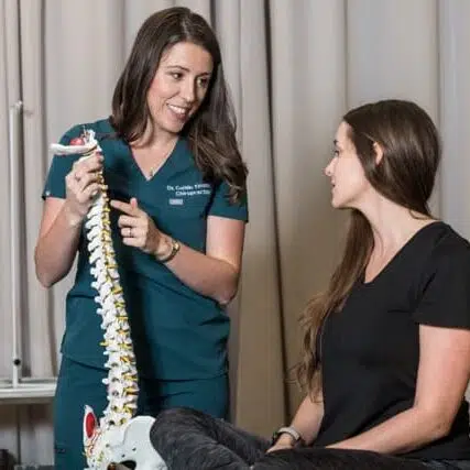 Chiropractor is doing some consultation with a patient at Core Health Spine & Rehab